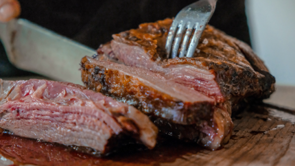 close up of perfectly cooked beef brisket being sliced