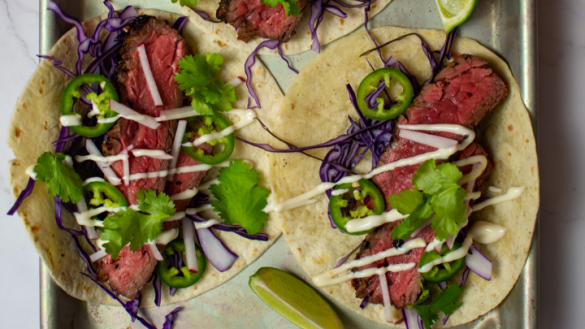 carne asada tacos with a drizzle of mayonnaise