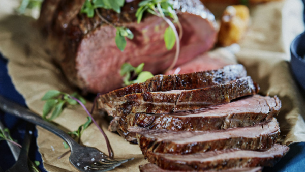 sliced medium rare roast beef with garnish